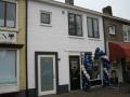 Winkel belegging met bovenwoning te Naarden